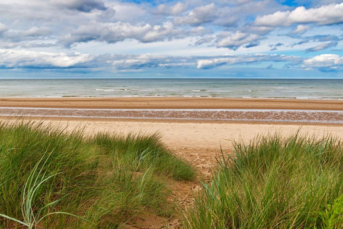 Omaha Beach today, calm and wide.